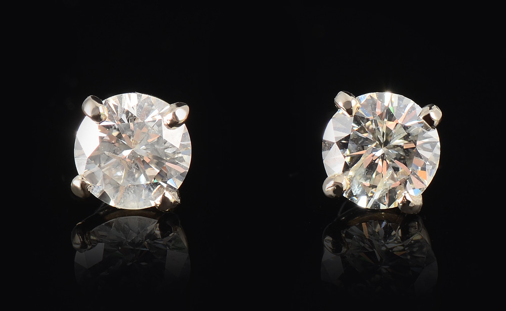 Appraisal: CT DIAMOND STUD EARRINGS Two round brilliant cut diamonds totaling