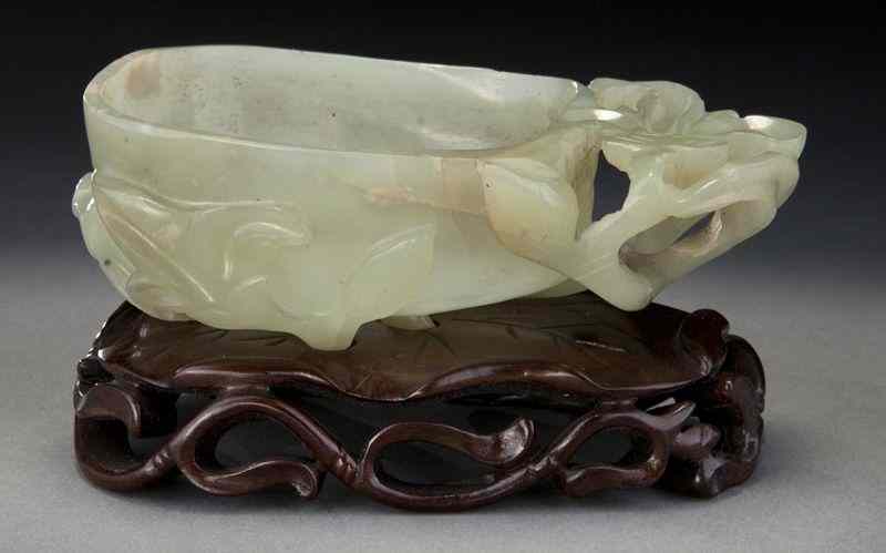 Appraisal: Chinese carved jade brush washerdepicting a magnolia blossom ''H x