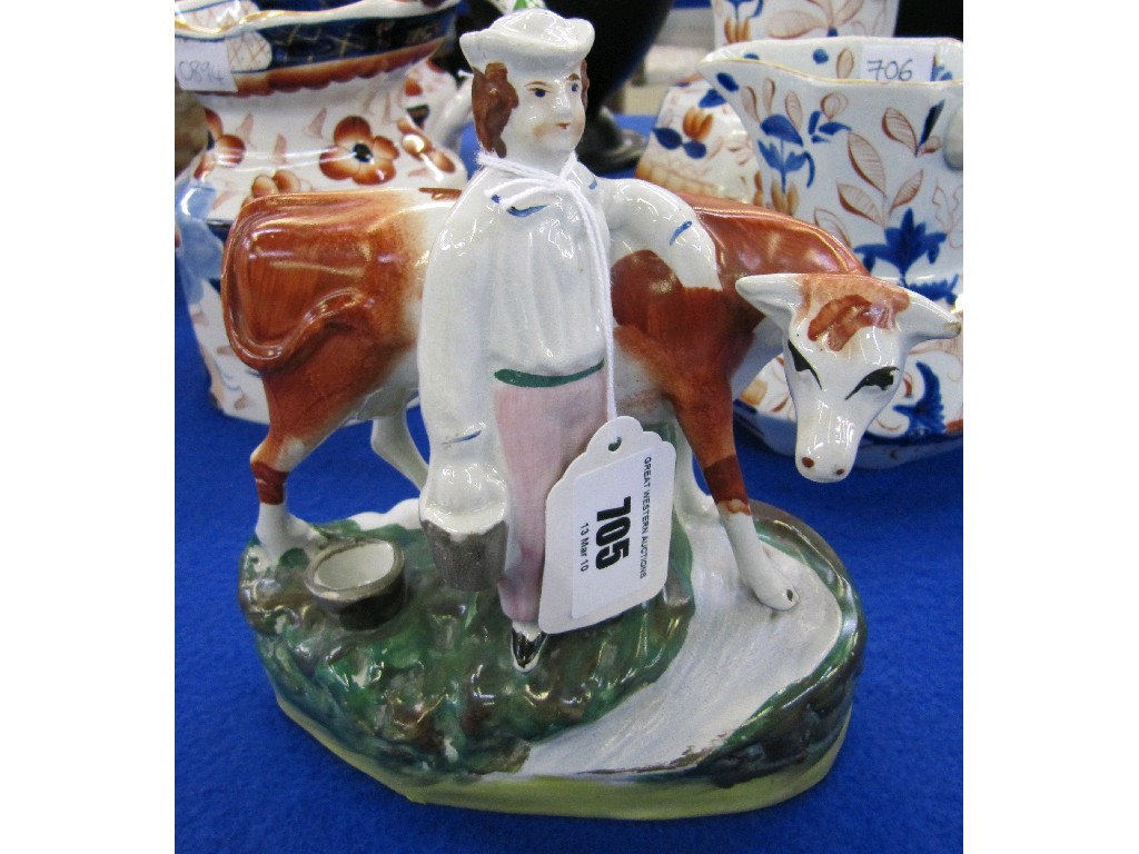 Appraisal: Staffordshire figure of a milkman and cow