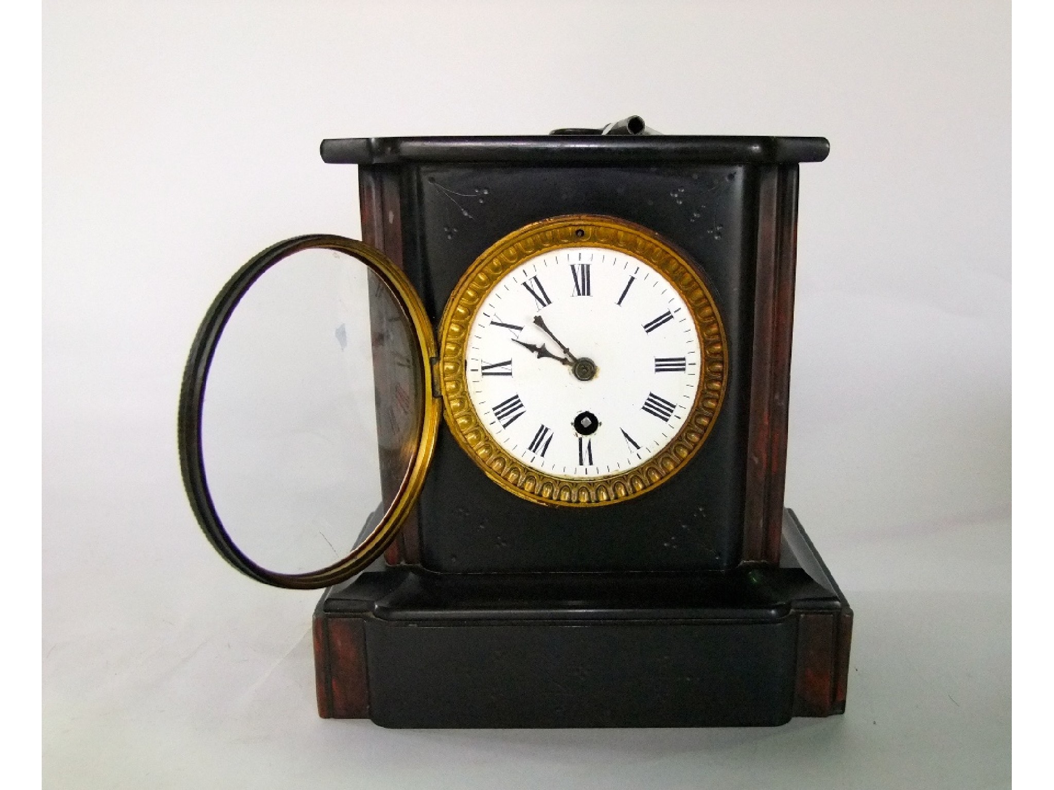 Appraisal: A Victorian black slate mantle clock with day timepiece key