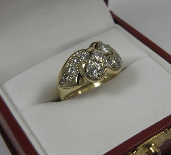 Appraisal: DIAMOND AND K GOLD RING set with round-cut diamonds together