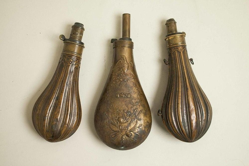 Appraisal: Three Metal Powder Flasks Three vintage metal powder flasks Dimensions