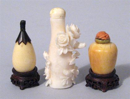 Appraisal: Two ivory snuff bottles and a white coral carved snuff