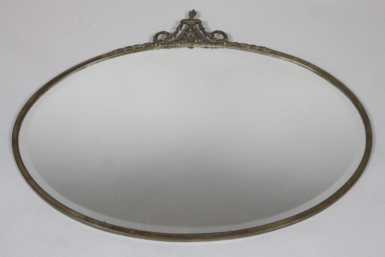 Appraisal: A thC style hanging mirror the oval bevelled glass on