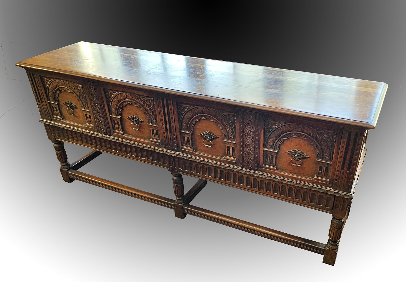 Appraisal: CARVED JACOBEAN STYLE KITTINGER SIDEBOARD Having elaborately carved paneled fronts