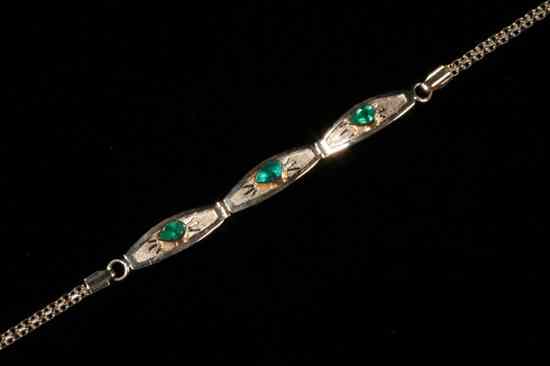 Appraisal: K YELLOW GOLD AND EMERALD DELICATE FLEXIBLE LINK BRACELET Three