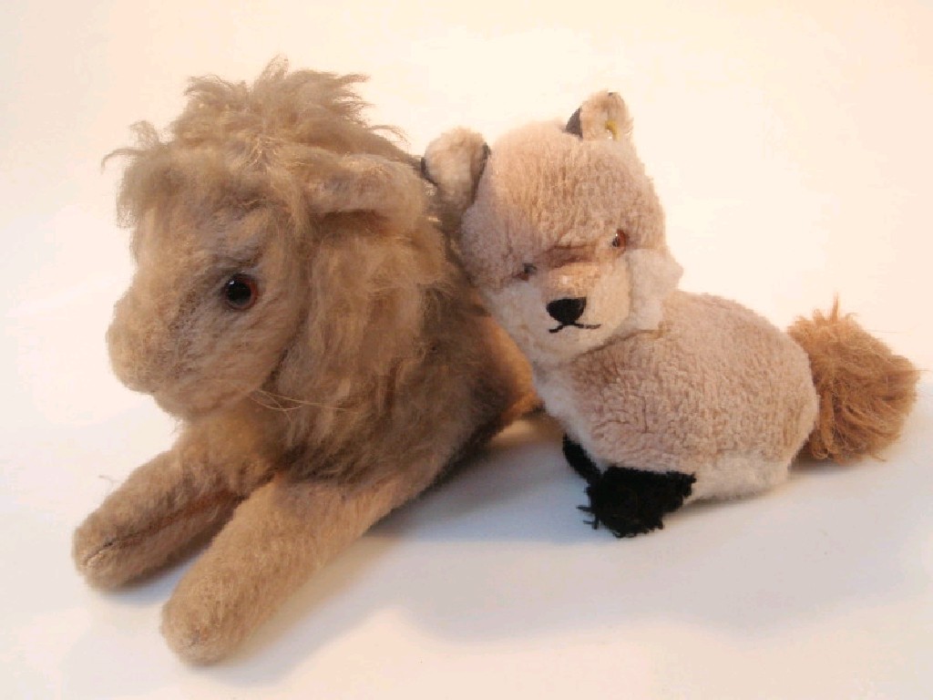 Appraisal: A Steiff fox with button in ear and a lion