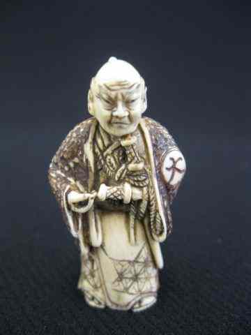 Appraisal: Carved Ivory Netsuke of a Samuri Warriorwith sword fine polychrome