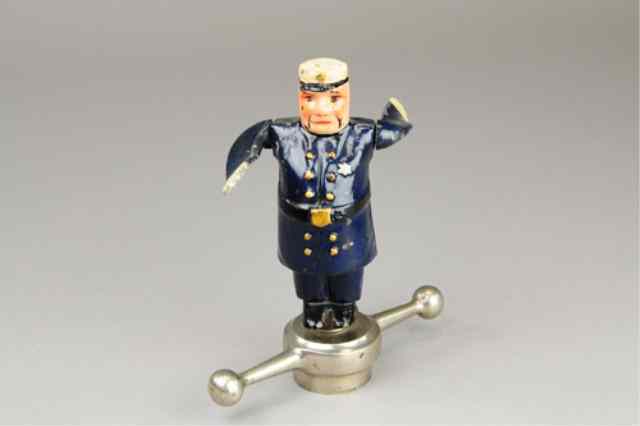 Appraisal: POLICEMAN RADIATOR WHIRLYGIG Painted aluminum and die-cast whimsical depiction of