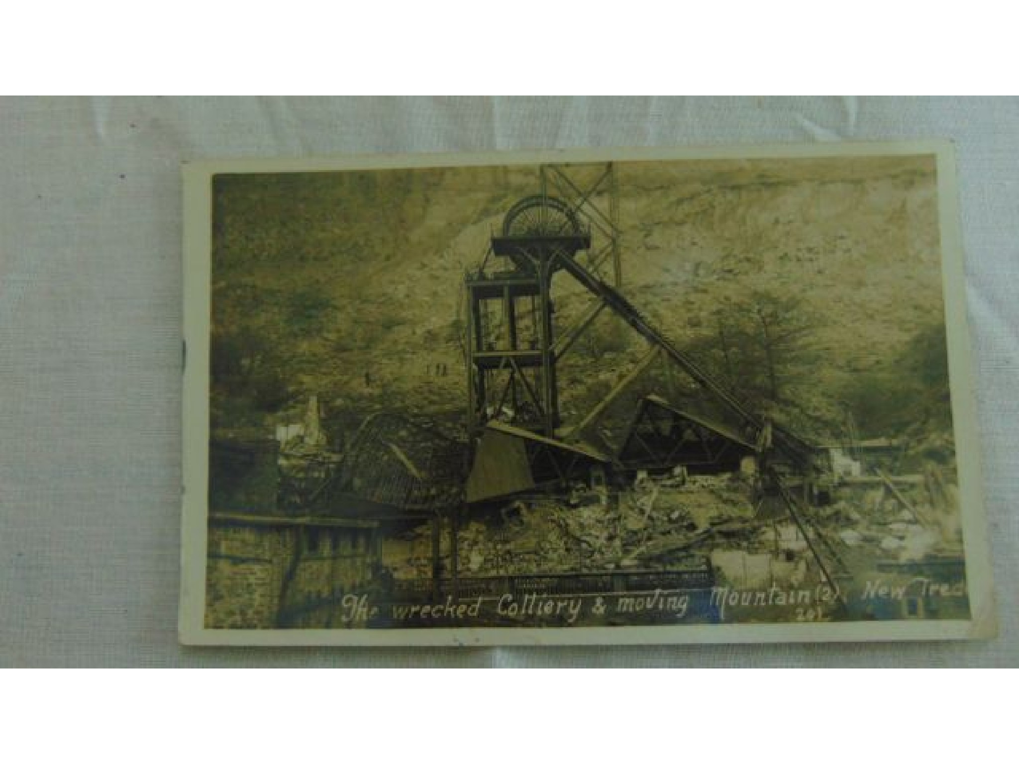 Appraisal: A good collection of Welsh postcards including wrecked mines street