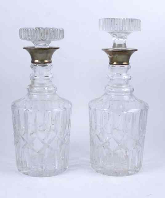 Appraisal: A pair of silver collared cut glass decanters London cm