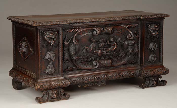 Appraisal: LAVISHLY CARVED LIFT TOP COFFER The hinged top having a