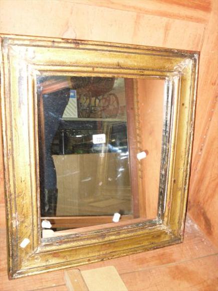 Appraisal: A painted framed wall mirror and an oval gilt carved