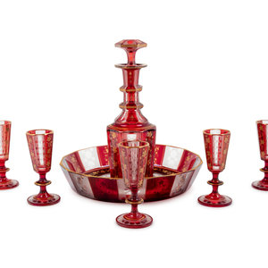 Appraisal: A Bohemian Gilt Decorated Ruby Cut-to-Clear Glass Liquor Set Late