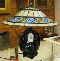 Appraisal: A STAINED AND LEADED GLASS TABLE LAMP The in diameter