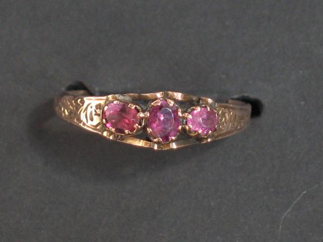 Appraisal: A VICTORIAN TOURMALINE RING the three graduated cushion-cut tourmalines in