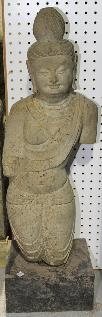 Appraisal: A pair of Gandharan style carved stone Buddha torsos probably