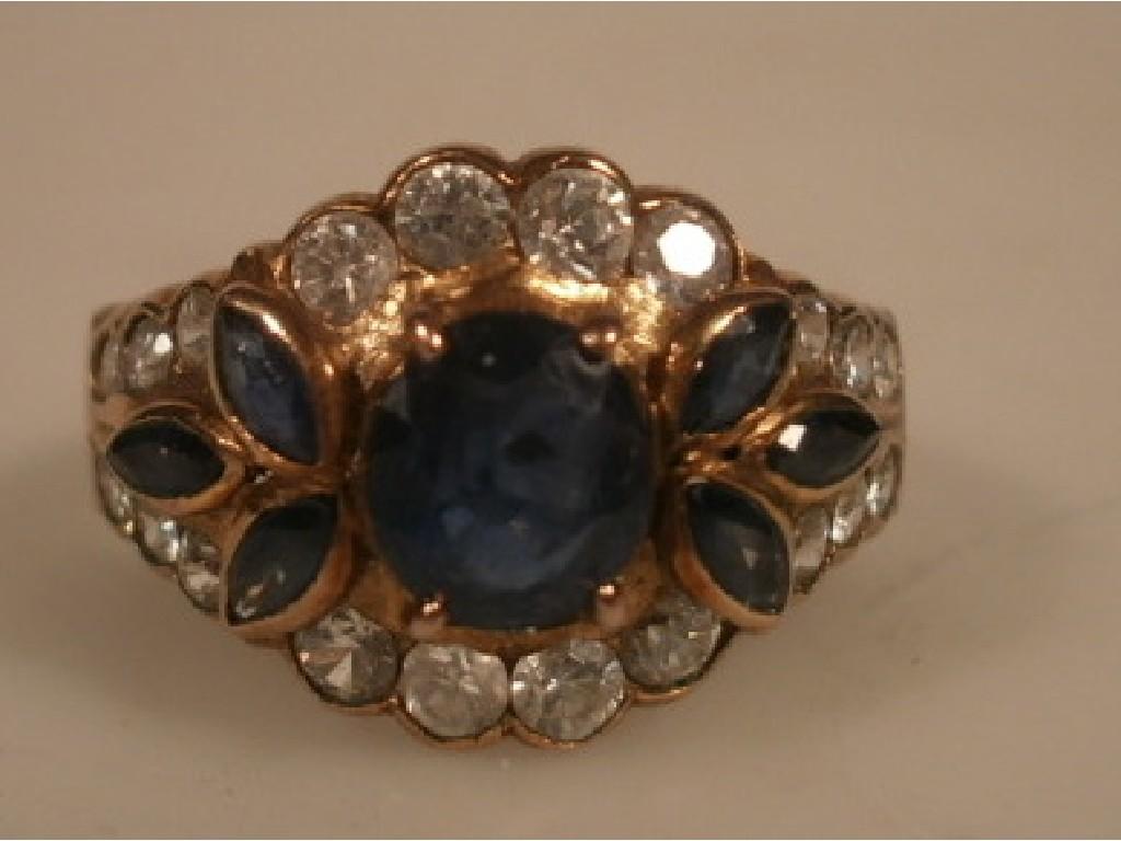 Appraisal: A diamond and sapphire set floral cluster dress ring set