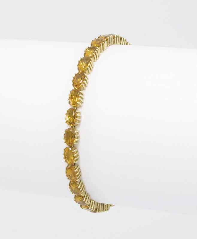 Appraisal: K CITRINE BRACELET K yellow gold bracelet contains oval mixed