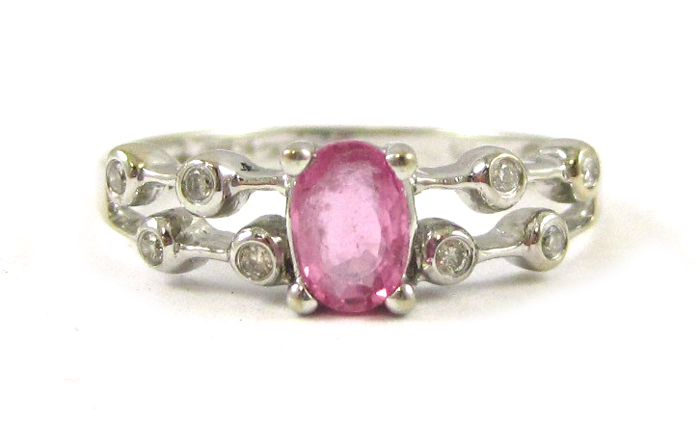 Appraisal: PINK SAPPHIRE AND FOURTEEN KARAT WHITE GOLD RING set with