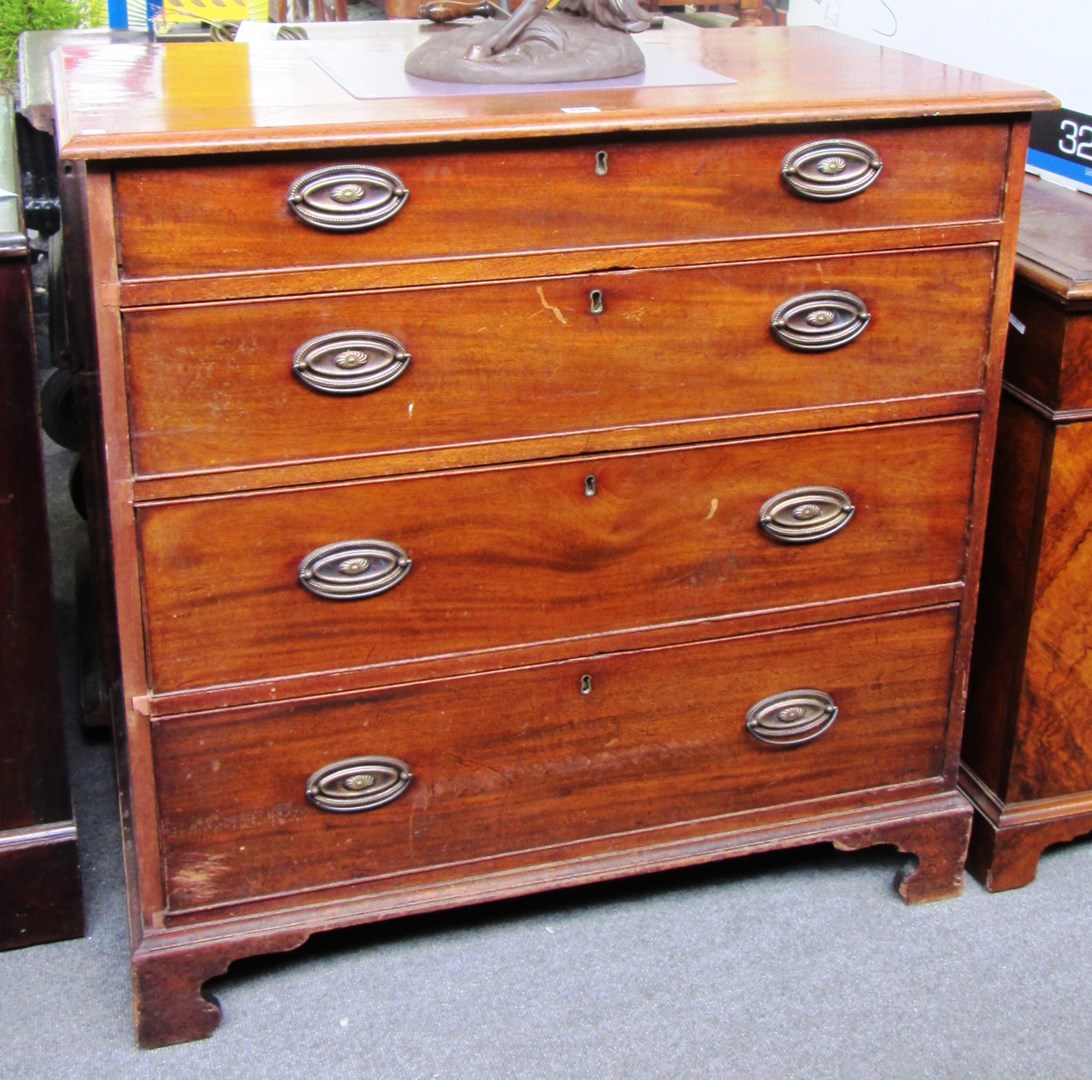 Appraisal: An th century mahogany chest of four long graduated drawers