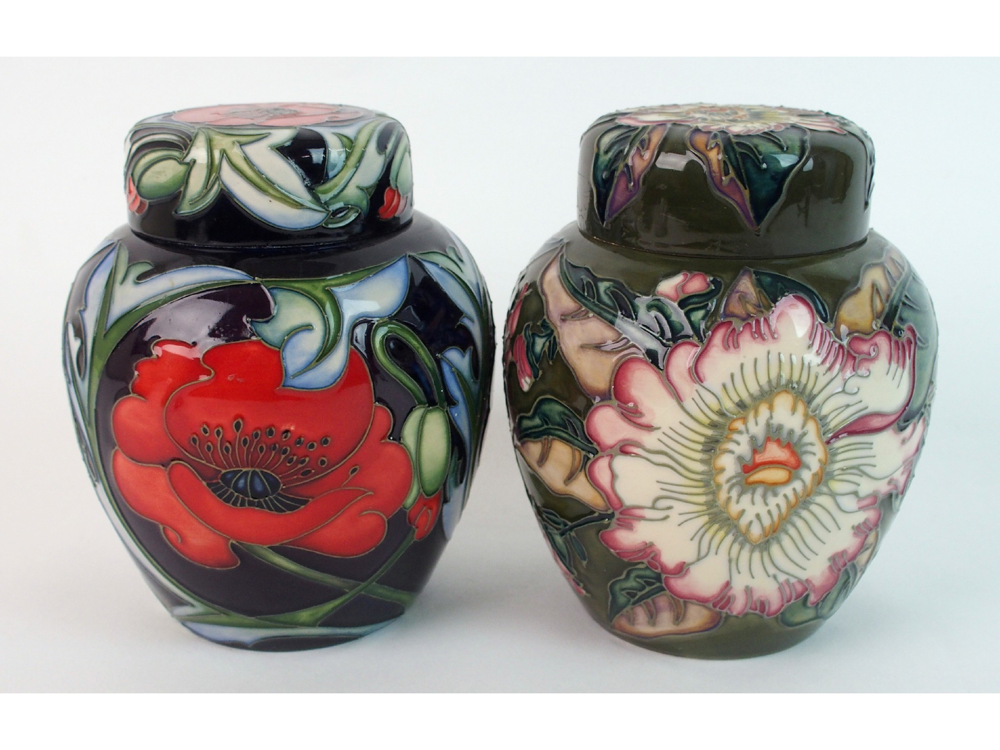 Appraisal: Two Moorcroft pottery ginger jars Gustavia Augusta and Poppythe Gustavia