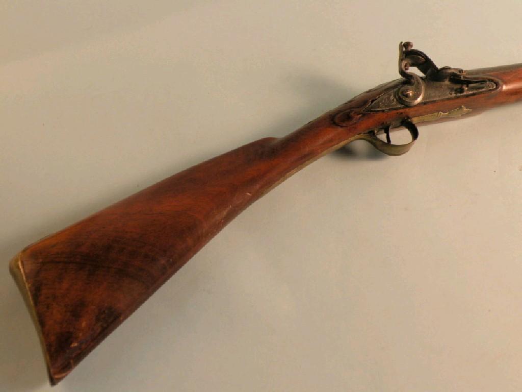 Appraisal: An thC full stock fowling musket with engraved steel fittings