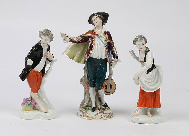 Appraisal: A CONTINENTAL PORCELAIN FIGURE of a mandolin player with polychrome