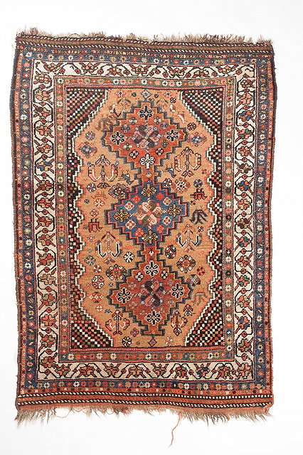 Appraisal: AN OLD SHIRAZ BROWN GROUND RUG with a central polychrome