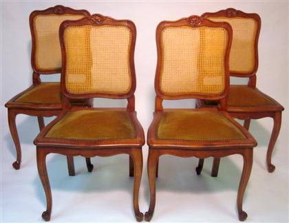 Appraisal: Four Louis XV style cherry side chairs The crested top