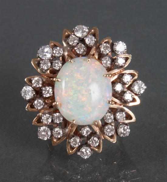 Appraisal: K yellow gold diamond and opal cocktail ring composed of