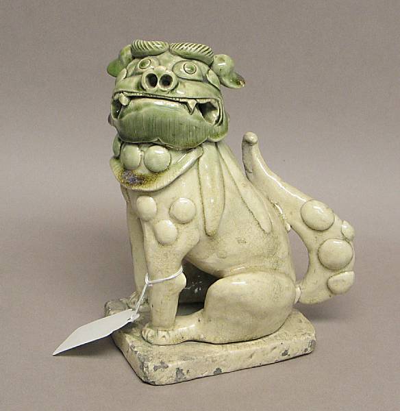 Appraisal: An Oribe style pottery shishi Partially seated on its haunches