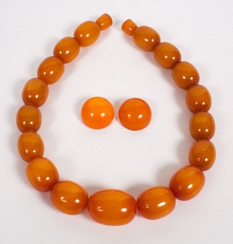 Appraisal: Bakelite amber necklace and similar earrings the necklace comprising a