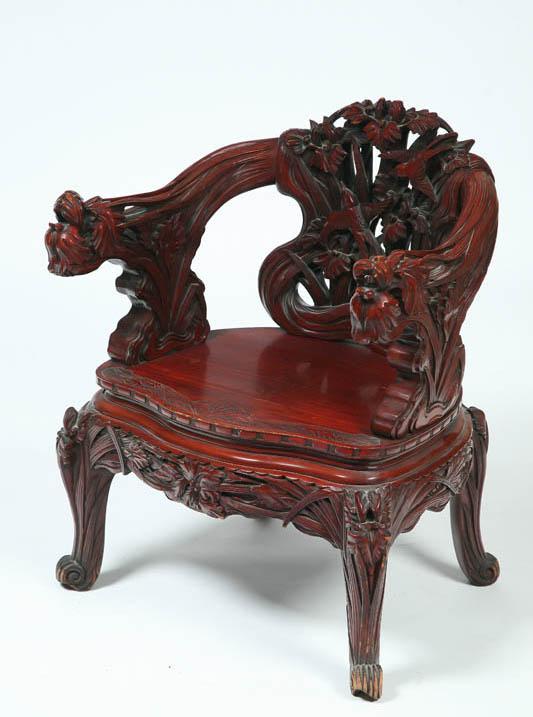 Appraisal: CARVED CHINESE ARMCHAIR Teakwood with ornately carved bird and foliate