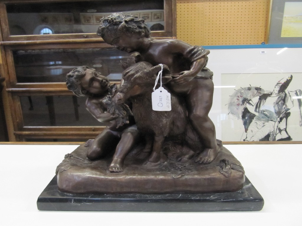 Appraisal: Bronzed figure group depicting cherubs and a goat