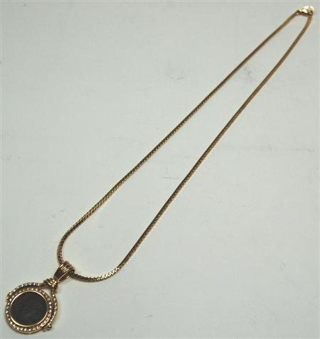 Appraisal: A modern diamond and coin set pendant with chain the