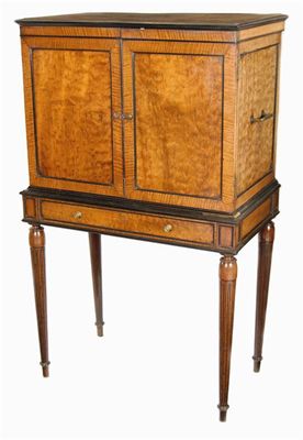 Appraisal: A fiddle back mahogany cabinet on stand with ebonised mouldings