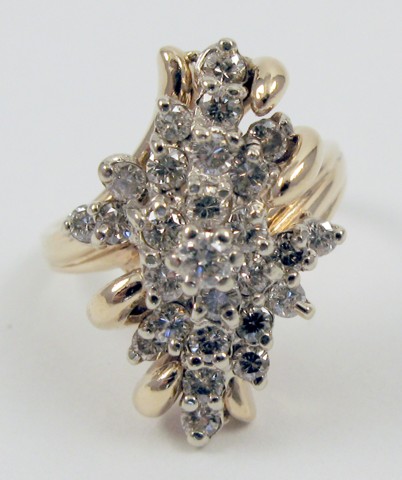 Appraisal: DIAMOND AND FOURTEEN KARAT GOLD RING set with round-cut diamonds