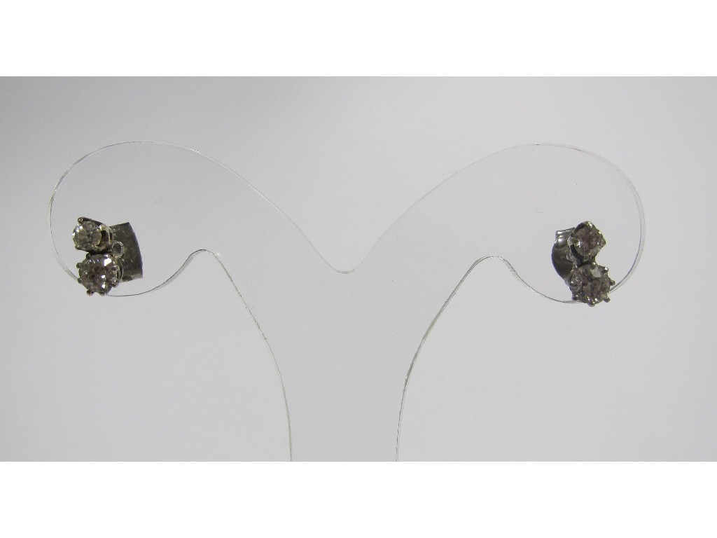 Appraisal: Two stone diamond stud earrings each with brilliant cut diamonds