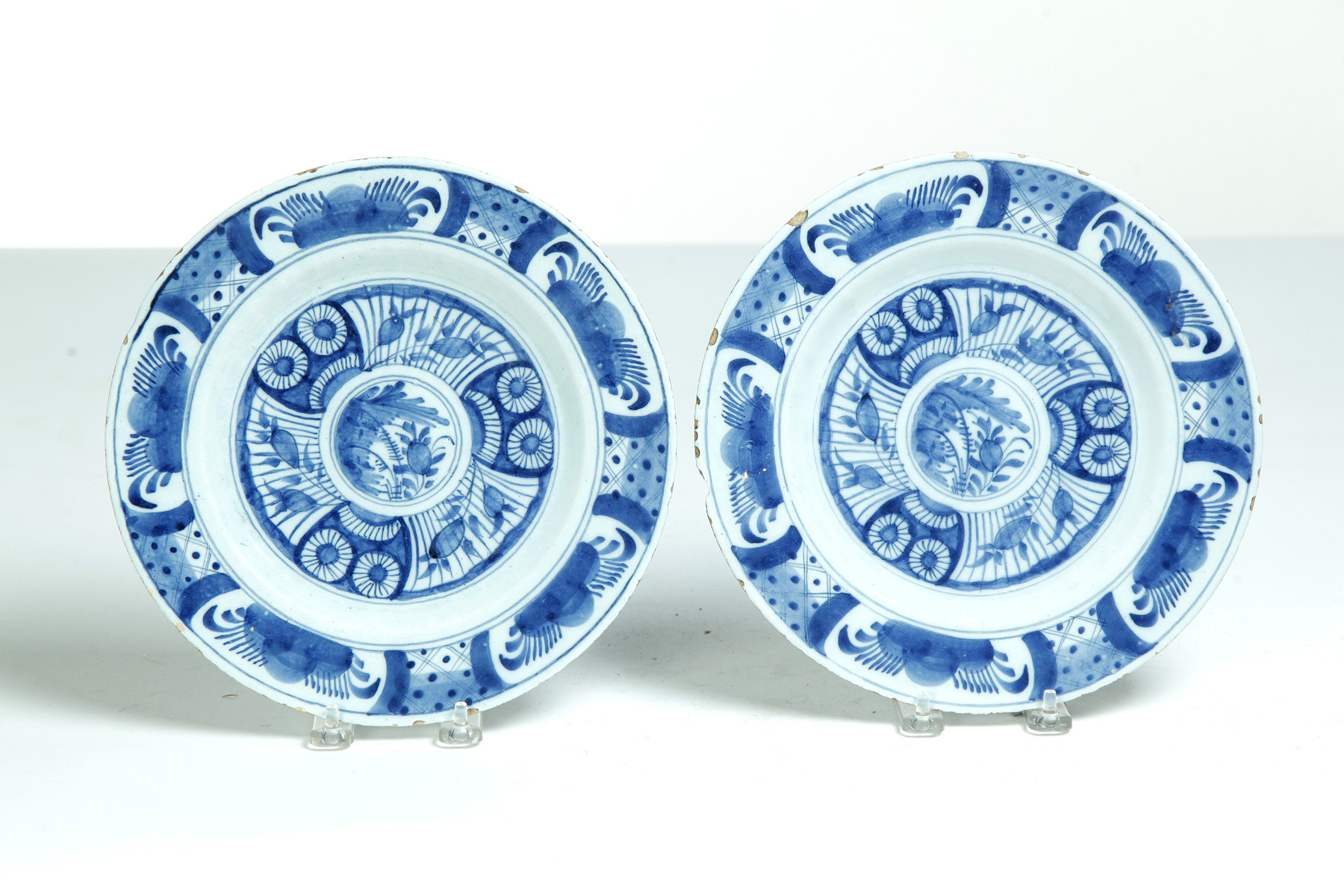 Appraisal: PAIR OF DELFT PLATES Probably England th century Tin glaze