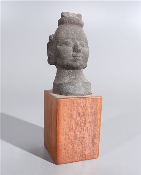 Appraisal: Indian stone head attached to wooden base head features incised