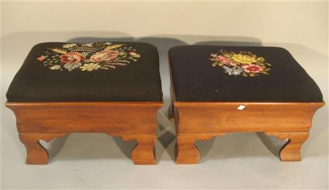 Appraisal: PAIR EMPIRE MAHOGANY OTTOMANS th century the needlepoint cushions above