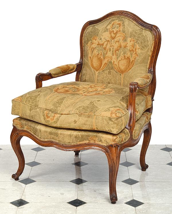 Appraisal: A LOUIS XV STYLE BERGERE with floral cloth upholstery above