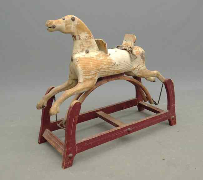 Appraisal: th c painted rocking horse Piece of wooden seat missing