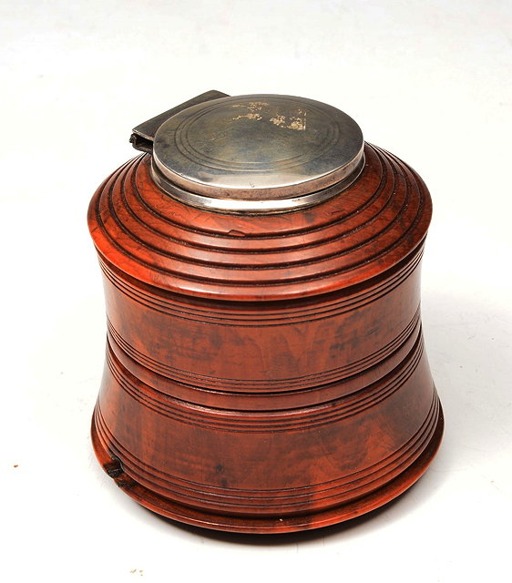 Appraisal: A TREEN INKWELL of ring turned cylindrical form with silver