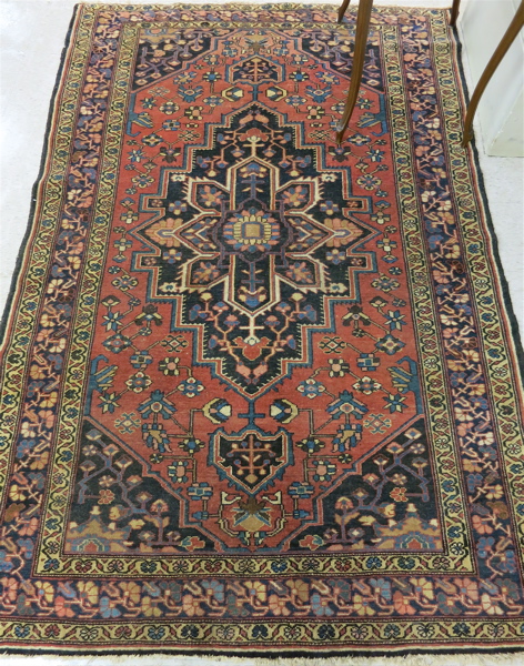 Appraisal: SEMI-ANTIQUE PERSIAN AREA RUG central geometric medallion and stylized floral