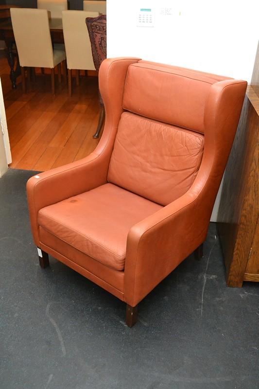 Appraisal: A DANISH WINGBACK LEATHER ARMCHAIR A DANISH WINGBACK LEATHER ARMCHAIR