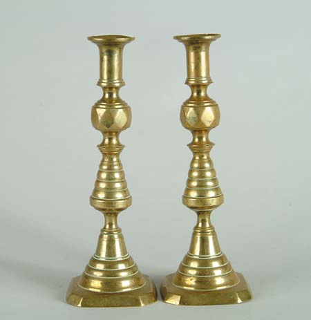 Appraisal: PAIR OF PUSHUP BRASS CANDLESTICKS Beehive form with push ups