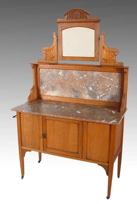 Appraisal: OAK MARBLE TOP WASHSTAND Mirrored washstand with marble backsplash and