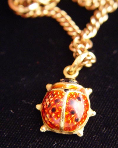 Appraisal: K CURB LINK CHAIN WITH K ENAMELED LADYBUG CHARM K